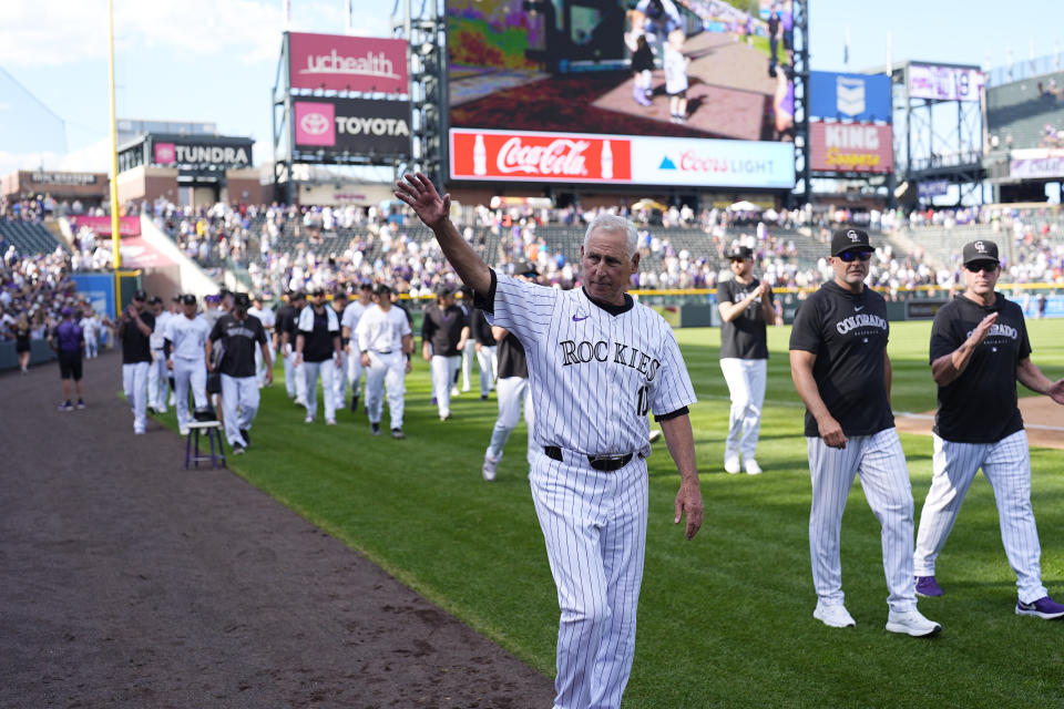 Colorado Rockies manager Bud Black waves to the crowd during the team's ceremonial walk around the field to acknowledge fans following a loss in the team's season finale Sunday, Sept. 29, 2024, in Denver. (AP Photo/David Zalubowski)