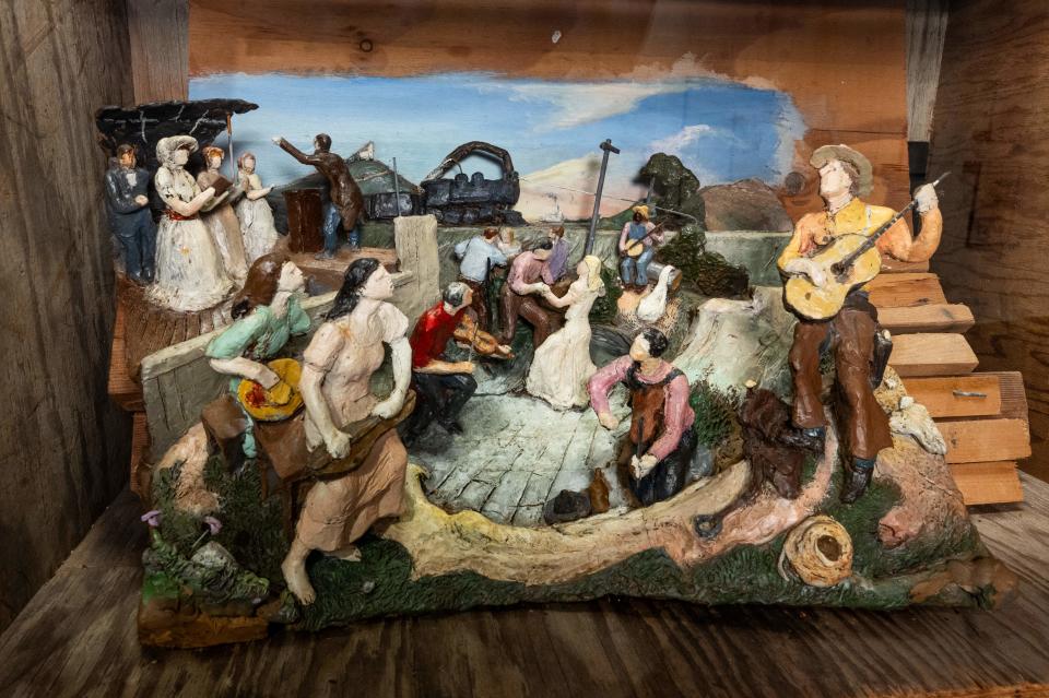 The clay three-dimensional clay maquette created as part of Benton's process of realizing "The Sources of Country Music" mural is part of the display at the Country Music Hall of Fame and Museum.