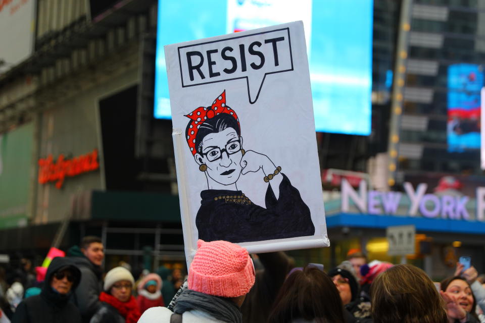 A supporter holds up a sign based on Rosie the Riveter with word “resist” after marching in the Women’s March on Jan. 19, 2019 in New York City. (Photo: Gordon Donovan/Yahoo News)