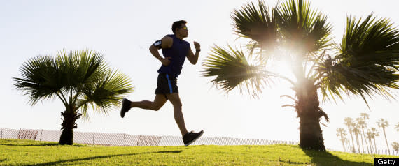 man running outside grass