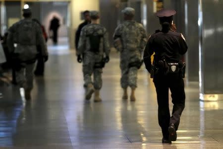 Security officers patrol inside New York's John F. Kennedy International Airport in New York, March 22, 2016. REUTERS/Mike Segar