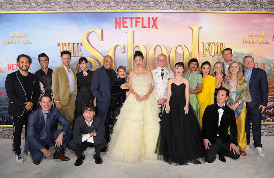 (L-R) Netflix's Nick Nesbitt, Jeff Kirschenbaum, Kit Young, Charlize Theron, Jamie Flatters, Laurence Fishburne, Patti LuPone, Sofia Wylie, Paul Feig, Sophia Anne Caruso, Kerry Washington, Michelle Yeoh, Laura Fischer, Kane Lee, Netflix Vice President of Global Film Content Acquisition Scott Stuber, Jane Startz, and Netflix Co-CEO and Chief Content Officer Ted Sarandos attend the World Premiere Of Netflix's The School For Good And Evil at Regency Village Theatre on October 18, 2022 in Los Angeles, California.