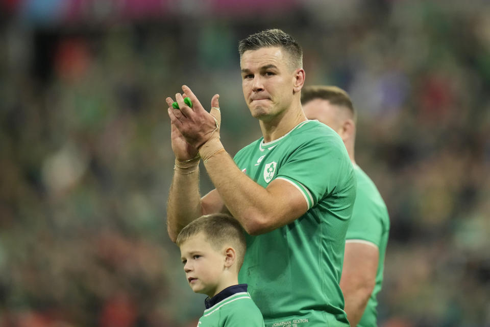 Ireland's Johnny Sexton applauds the fans after the end of the Rugby World Cup quarterfinal match between Ireland and New Zealand at the Stade de France in Saint-Denis, near Paris Saturday, Oct. 14, 2023. New Zealand won the game 28-24. (AP Photo/Christophe Ena)