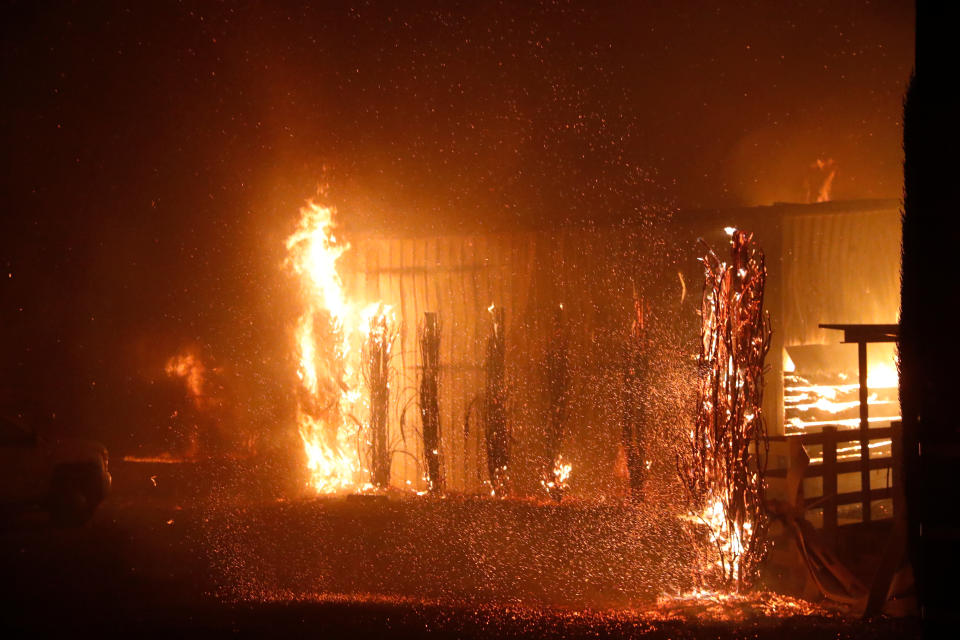 A burning structure is seen during the wind-driven Kincade Fire in Windsor, California, Oct. 27, 2019.(Photo: Stephen Lam/Reuters)