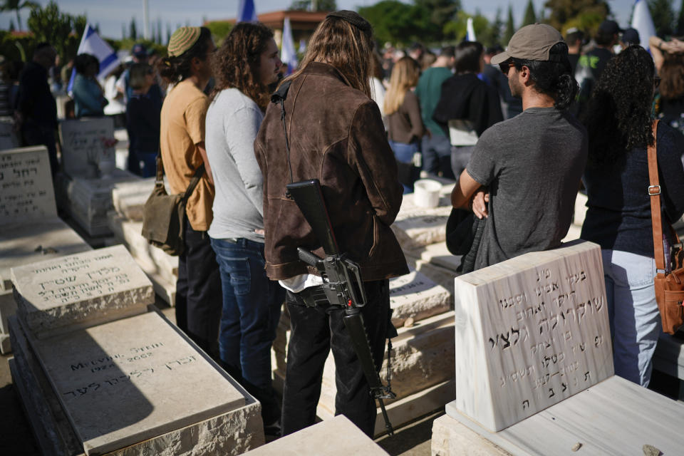 Mourners attend the funeral of Israeli soldier Master Sgt. Gal Meir Eizenkot, 25, who was killed in fighting in Gaza, at the military cemetery in Herzliya, Israel, on Friday, Dec.8, 2023. The death of Eizenkot, the son of Gadi Eizenkot, Israel's former army chief who is also currently a member of Israel's war cabinet, has resonated across the country and drawn condolences from Israel's top leaders (AP Photo/Leo Correa)