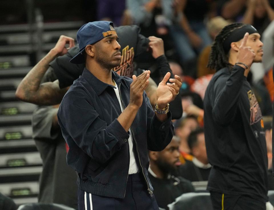 Phoenix Suns guard Chris Paul claps for his team against the Denver Nuggets during Game 6 of the Western Conference semifinals at Footprint Center in Phoenix on May 11, 2023.