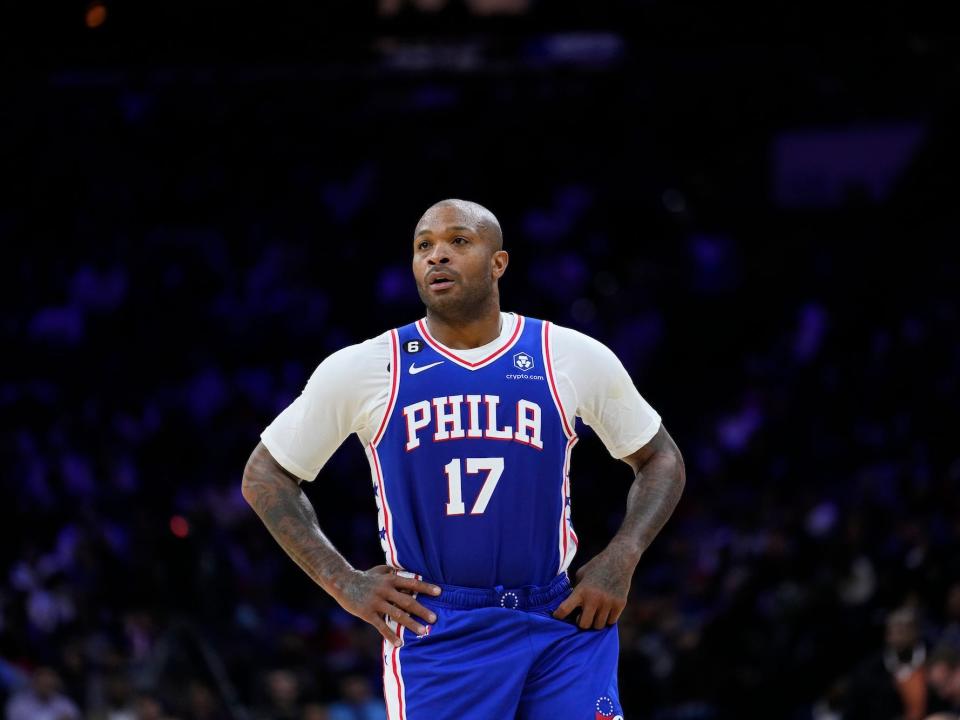 PJ Tucker puts his hands on his hips and looks up during a Sixers game.