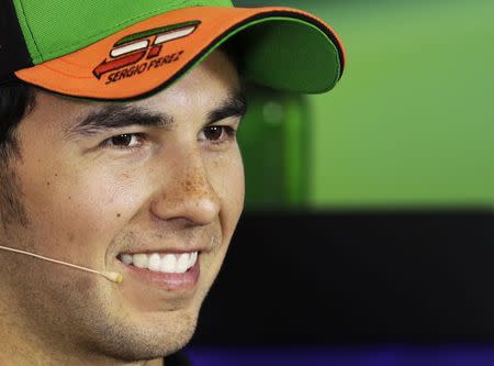 Force India Formula One driver Sergio Perez of Mexico smiles during a news conference at the Hungaroring circuit, near Budapest July 24, 2014. REUTERS/David W Cerny