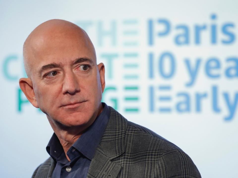 Jeff Bezos looking behind to the side