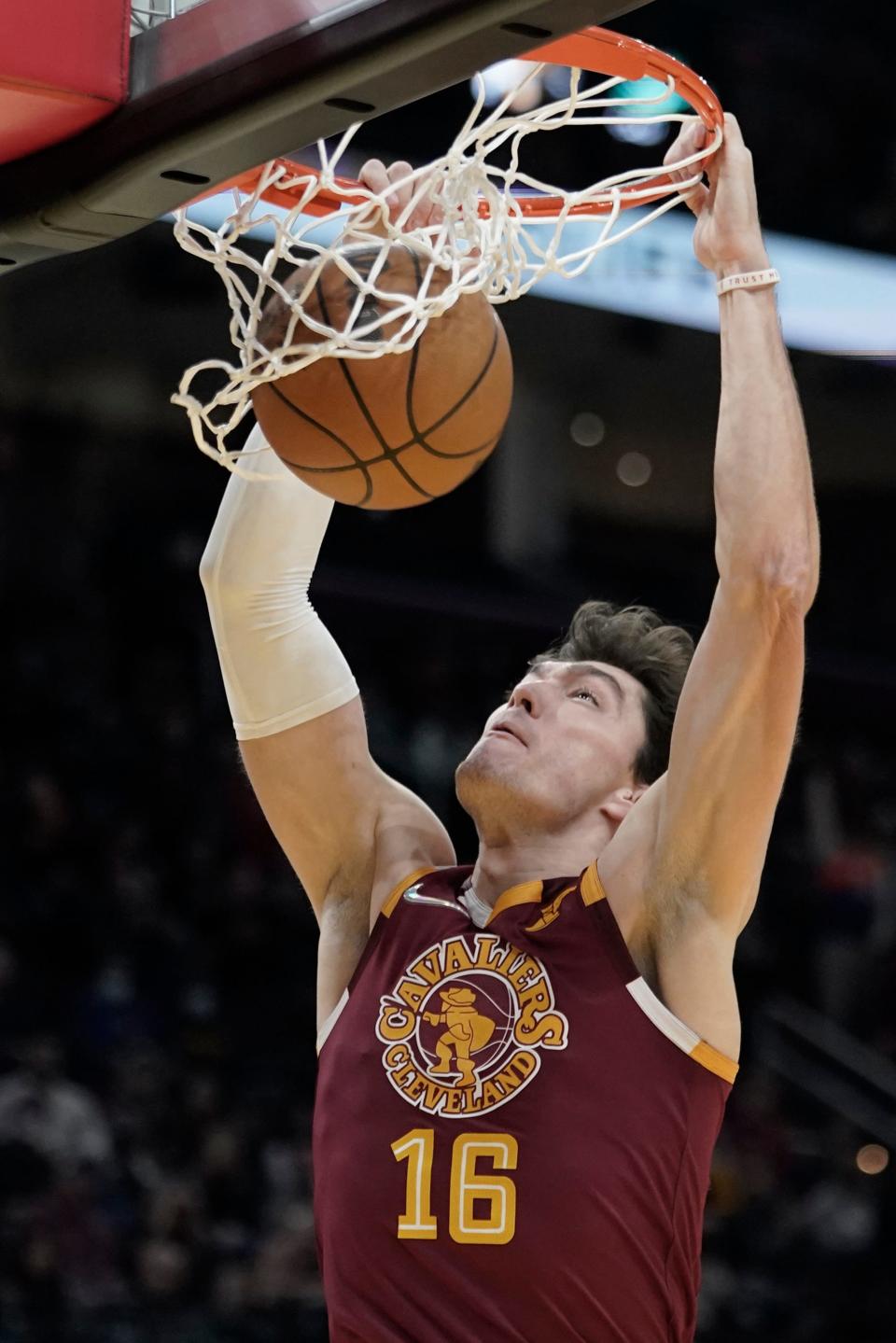 Cleveland Cavaliers' Cedi Osman dunks against the Utah Jazz in the second half of an NBA basketball game, Sunday, Dec. 5, 2021, in Cleveland. (AP Photo/Tony Dejak)