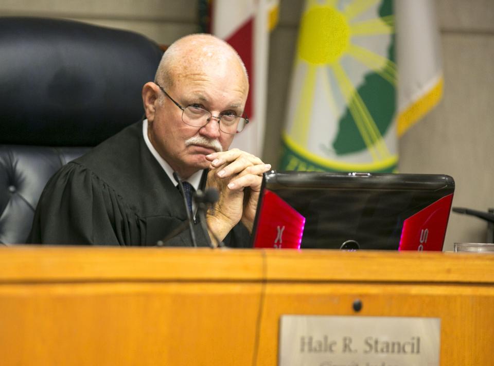 Circuit Judge Hale Stancil listens to court action during Dustin Heathman's trial in Ocala on Dec. 15, 2015.