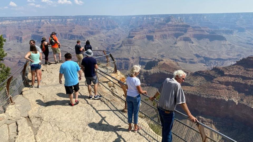 Visitors take in the view from the Grand Canyon's South Rim in this file photo from August 24, 2020.