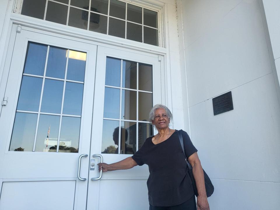 Lois Young Blanchard, 79, stands at the door of Nicholls State University 60 years after she was one of the first 21 Black students to integrate into the student body in September of 1963. She was one of the first seven students to integrate. The tree was a location the group would gather to escape the animosity they faced.