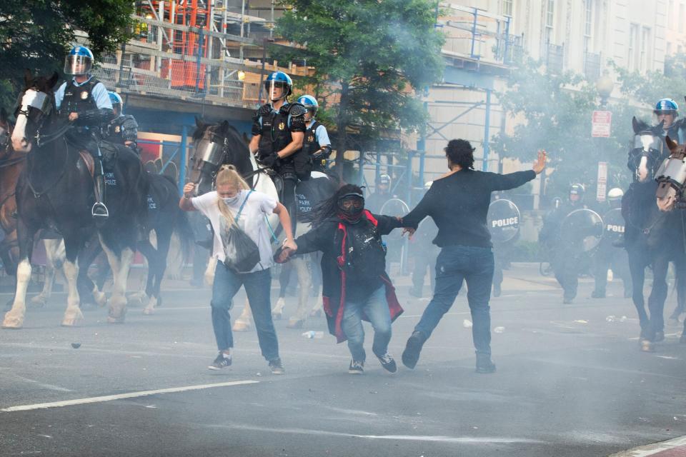 Protesters were tear-gassed as the police dispersed them near the White House on Monday to make way for what became President Donald Trump's controversial photo-op at a church. (Photo: ROBERTO SCHMIDT via Getty Images)