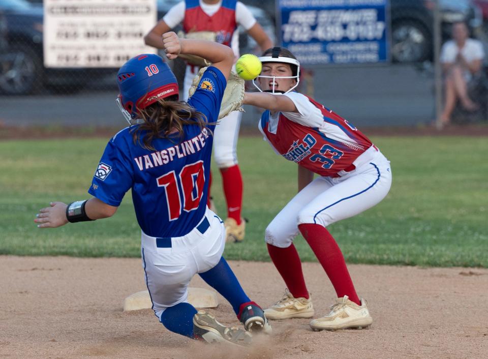 Toms River Sophie Vansplinter makes it safely to second as throw to Freehold’s Francesca Svoboda arrives late. Toms River Little League Softball defeats Freehold Twp 3-2 in Sayreville, NJ on July 5, 2023. 