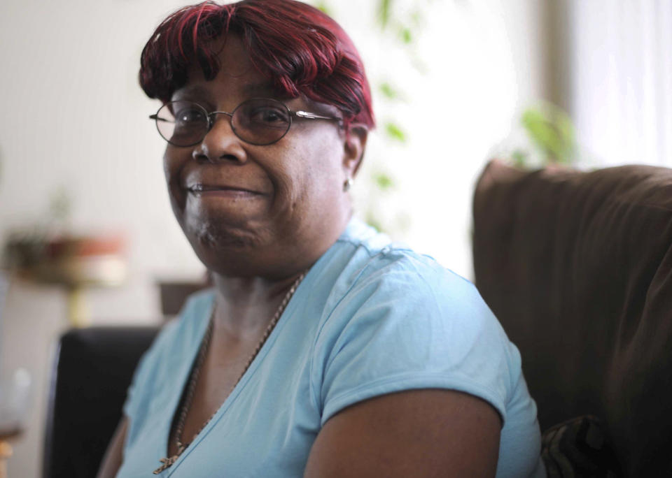 In this April 7, 2014 photo, Deborah Hughes sits for a photo in Detroit. Police credited Hughes with saving the life of Steve Utash. Hughes stepped between Utash and the half-dozen or more men who punched and kicked him after an April 2 accident on the northeast side of Detroit where he accidentally hit a young boy with his vehicle. (AP Photo/Detroit News, Elizabeth Conley) DETROIT FREE PRESS OUT; HUFFINGTON POST OUT