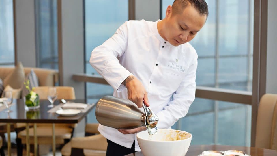 Chef Trung puts the finishing touches on the pho. - Suteera Chalermkarnchana