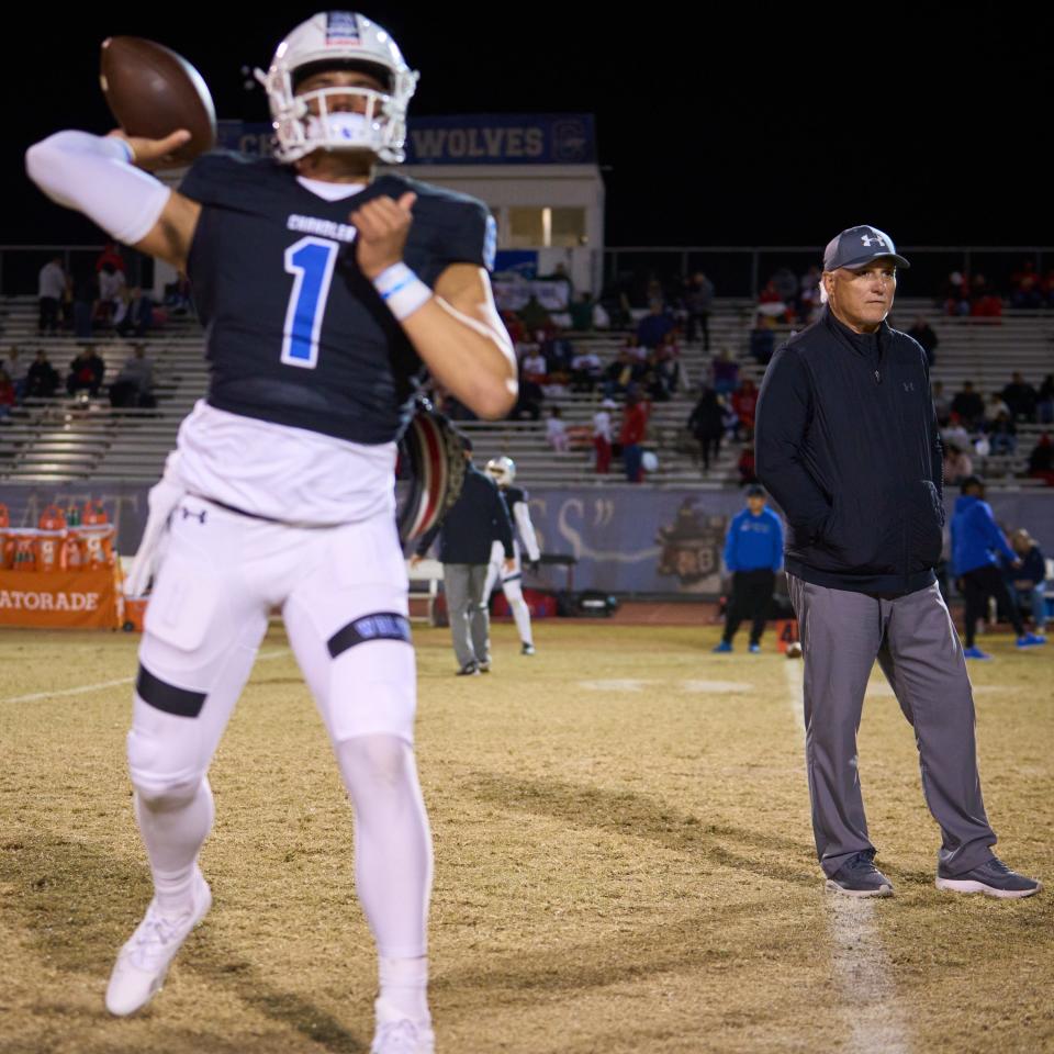 Chandler Wolves head coach Rick Garretson watches as quarterback Dylan Raiola (1) and his team warm-up to face the Centennial Coyotes at Chandler High School's Austin Field on Friday, Nov. 25, 2022.
