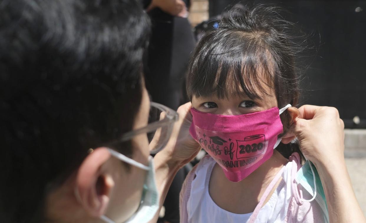 <span class="caption">Children are at risk of getting sick from coronavirus and need to practice social distancing and mask wearing too. </span> <span class="attribution"><a class="link " href="http://www.apimages.com/metadata/Index/Virus-Outbreak-Schools-Reopening/d525fbee0dd2409d8d0bc4693779c4b9/1/0" rel="nofollow noopener" target="_blank" data-ylk="slk:AP Photo/Seth Wenig, File;elm:context_link;itc:0;sec:content-canvas">AP Photo/Seth Wenig, File</a></span>