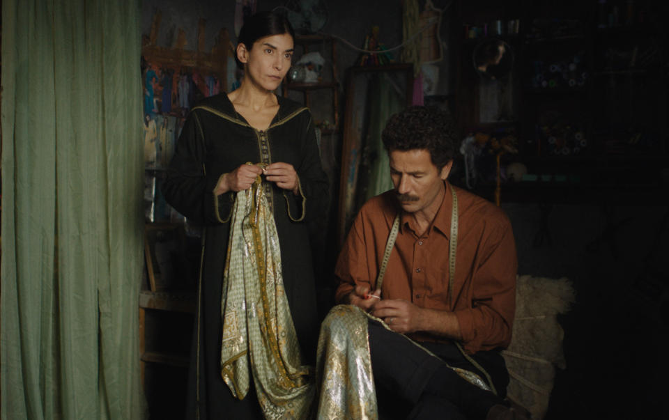 This image released by Strand Releasing shows Lubna Azabal, left, and Saleh Bakri in a scene from "The Blue Caftan" directed by Maryam Touzani. (Strand Releasing via AP)