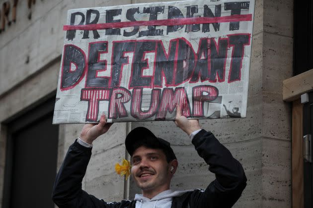 A protester holds a sign outside Trump Tower in New York City.