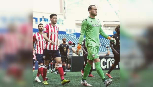 Atlético Ottawa goalkeeper Dylon Powley (right) is one of many players in the Canadian Premier League who want to form a labour union to represent their interests. (Robert Reyes Ong - image credit)