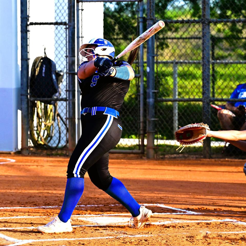 Park Vista's Nicole Mergen take a big swing, crushing a home-run in the first inning of the Cobras' regular season game against Seminole Ridge on April 2, 2024.