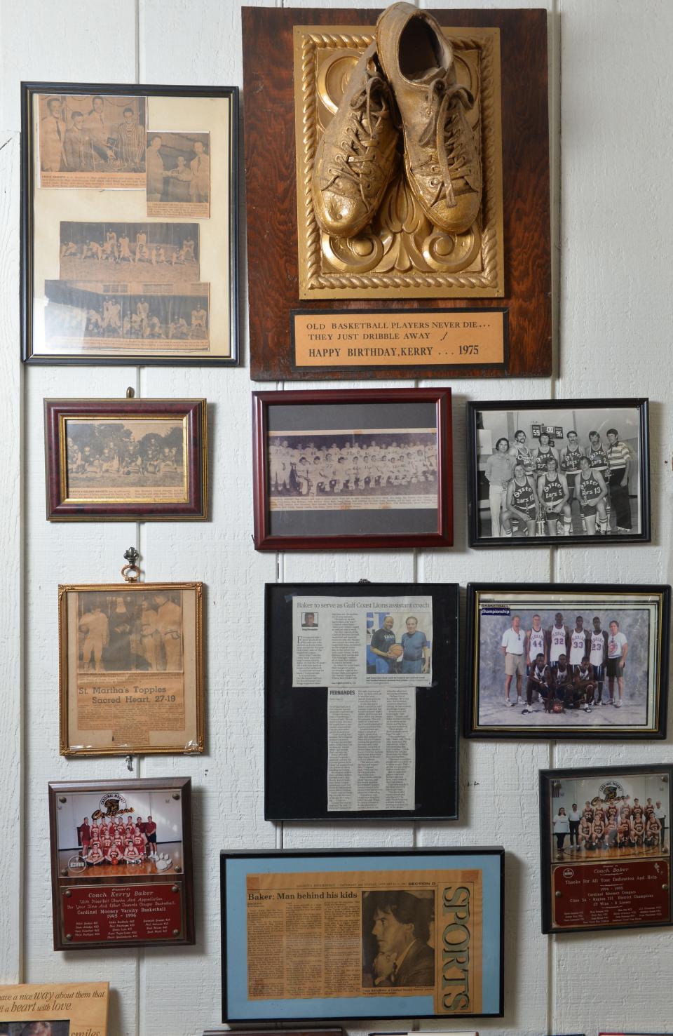 Framed newspaper articles, team photos and plaques decorate a corner of a room, filled with Sarasota sports memorabilia at long-time basketball coach Kerry Baker's home in Sarasota. At the top left, is a photo of Kerry Baker's 8th grade basketball team at St. Martha's. On the right is a team photo of the Sarasota Oyster Bar semi-pro basketball team.