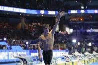 Bobby Finke waves after winning the men's 800 freestyle during wave 2 of the U.S. Olympic Swim Trials on Thursday, June 17, 2021, in Omaha, Neb. (AP Photo/Jeff Roberson)