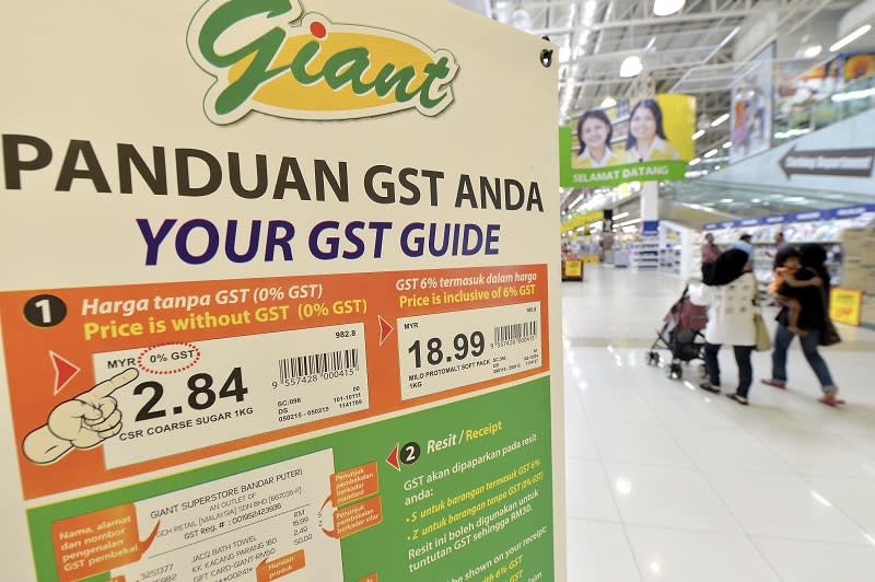 A signboard explaining how the GST works is seen at the Giant store in Kota Damansara, April 2, 2015. — Bernama pic