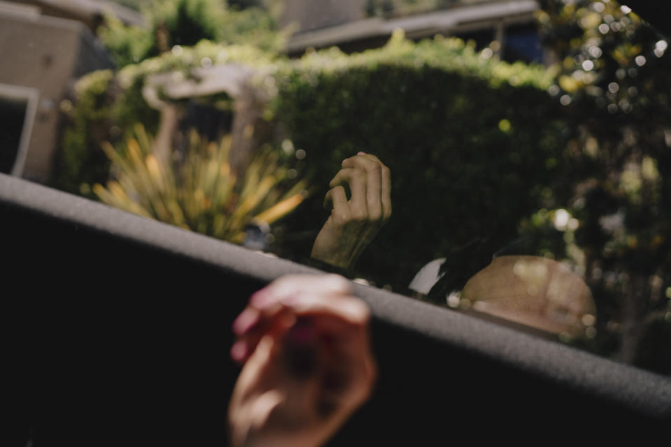 Desiree Townsend’s hand reflected on a window during a car ride in Laguna Beach, California. (Isadora Kosofsky for NBC News)