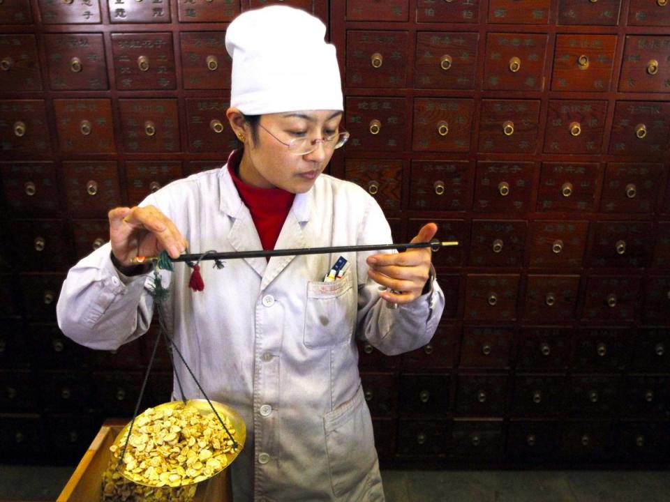 A worker weighs Chinese herbs as she prepares prescriptions at Beijing's Capital Medical University Traditional Chinese Medicine Hospital April 6, 2010. The hospital distributes around 20,000 doses of their herbal medicine daily, which amounts to more than five tonnes of ingredients. Traditional Chinese medicine practitioners are offering their treatments as an alternative to vaccinations after a series of health product safety scandals in China over the past few years. China's Health Ministry announced today an immediate investigation into bad vaccines that have been blamed for the deaths of four children in northern Shanxi province. China, often called the world's factory, is struggling to convince a sceptical domestic and global audience it has won a battle to improve safety standards. The world will mark World Health Day on April 7.