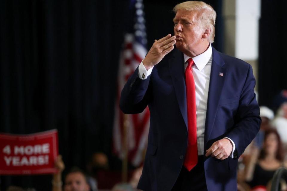 Donald Trump blows a kiss to the crowd as he concludes a campaign rally in Nevada.