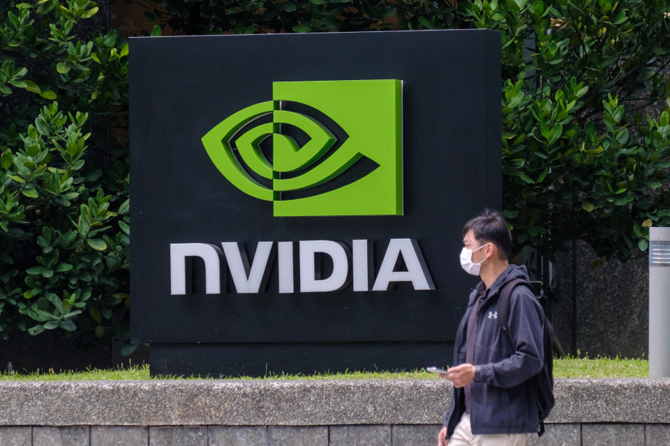 TAIPEI, TAIWAN - 2021/03/30: A man wearing a mask walks past an Nvidia logo in Taipei. (Photo by Walid Berrazeg/SOPA Images/LightRocket via Getty Images)