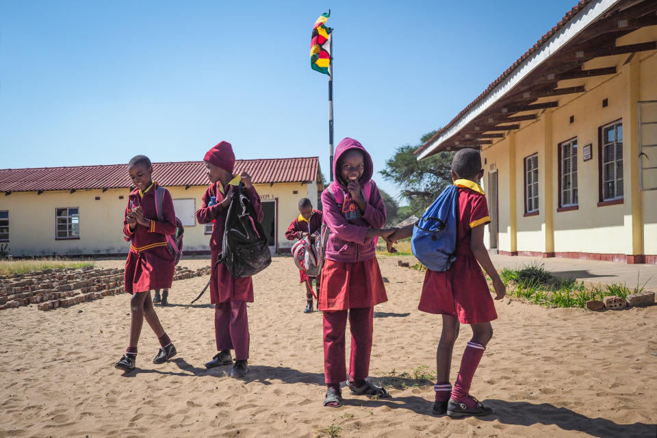 African schoolchildren on their way to class