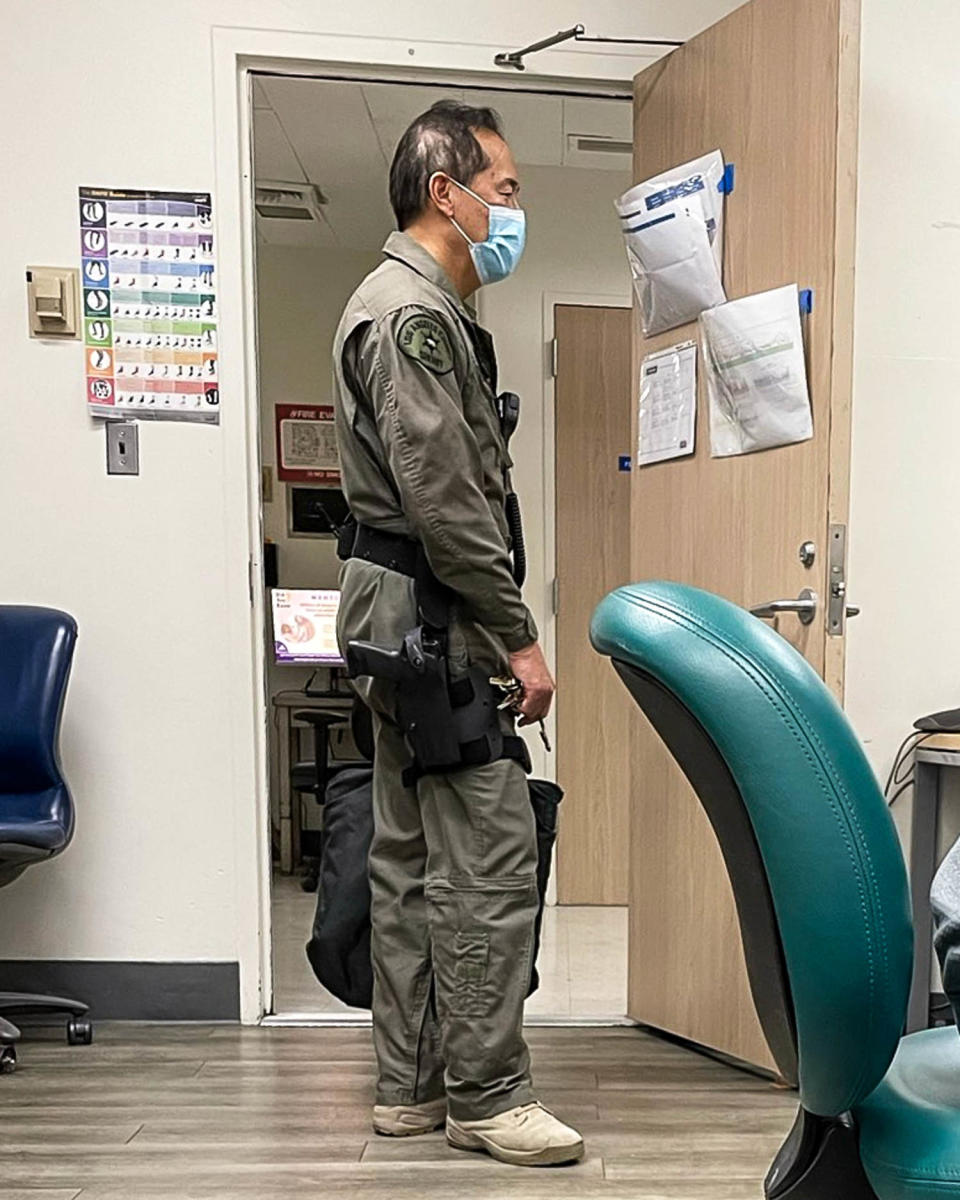 Dr. Lewis Kwong with a gun at work at the hospital. He is a volunteer deputy sheriff for L.A. County. (Obtained by NBC News)