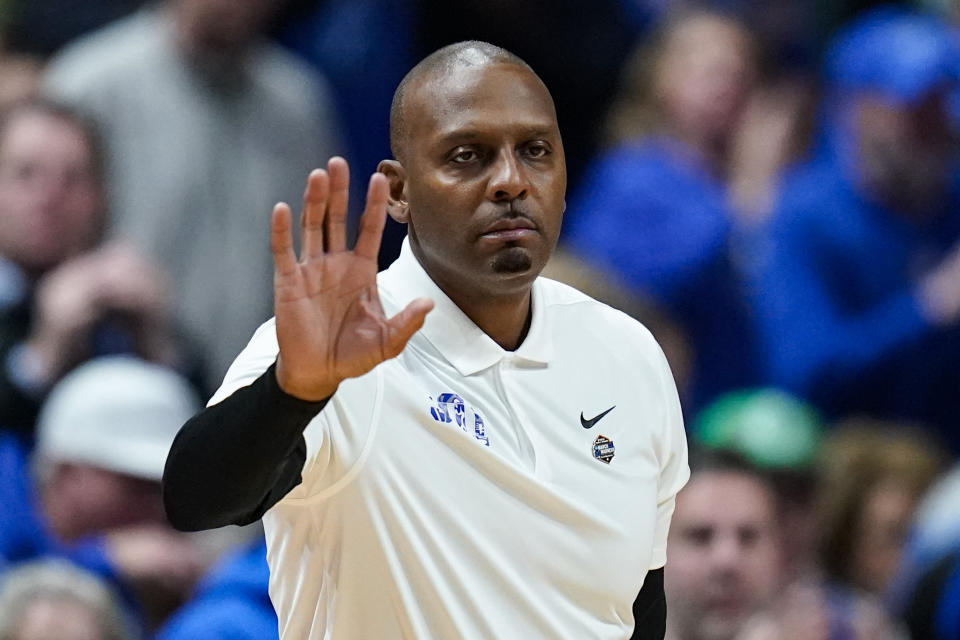 Memphis head coach Penny Hardaway waves to her team as they play against Florida Atlantic in the first half of a first-round college basketball game at the NCAA Men's Tournament in Columbus, Ohio, Friday, March 17, 2023. (AP Photo/Michael Conroy)