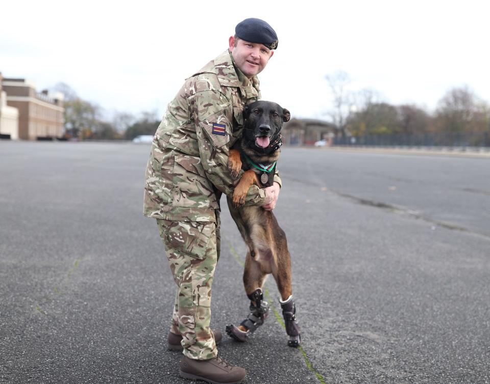 <p>A military working dog handler with Kuno, a four-year-old Belgian Shepherd Malinois and military working dog, at Woolwich Barracks in London, with his PDSA Dickin Medal for valour, the highest award any animal can receive whilst serving in military conflict</p>PA