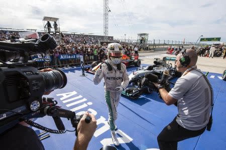 Oct 23, 2016; Austin, TX, USA; Mercedes driver Lewis Hamilton (44) of Great Britain waves to the camera after winning the United States Grand Prix at the Circuit of the Americas. Mandatory Credit: Jerome Miron-USA TODAY Sports