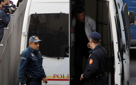 Montenegrin police escort men to a court session with the state attorney in Podgorica, Montenegro, October 16, 2016. REUTERS/Stevo Vasiljevic