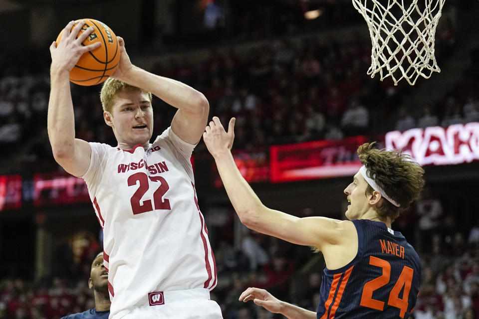 Wisconsin's Steven Crowl (22) grabs a defensive rebound against Illinois's Matthew Mayer (24) during the first half of an NCAA college basketball game, Saturday, Jan. 28, 2023, in Madison, Wis. (AP Photo/Andy Manis)