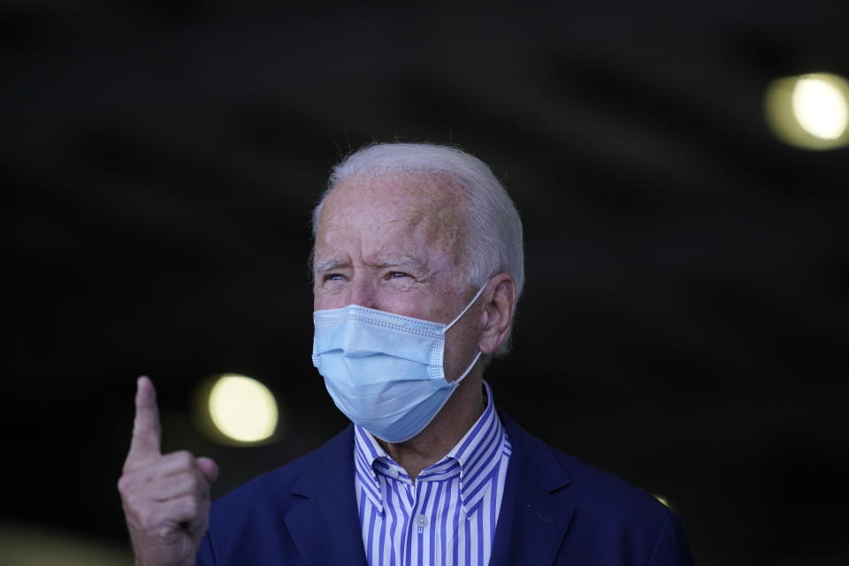 Democratic presidential candidate former Vice President Joe Biden speaks to members of the media before leaving Phoenix Sky Harbor International Airport, in Phoenix, Thursday, Oct. 8, 2020. (AP Photo/Carolyn Kaster)