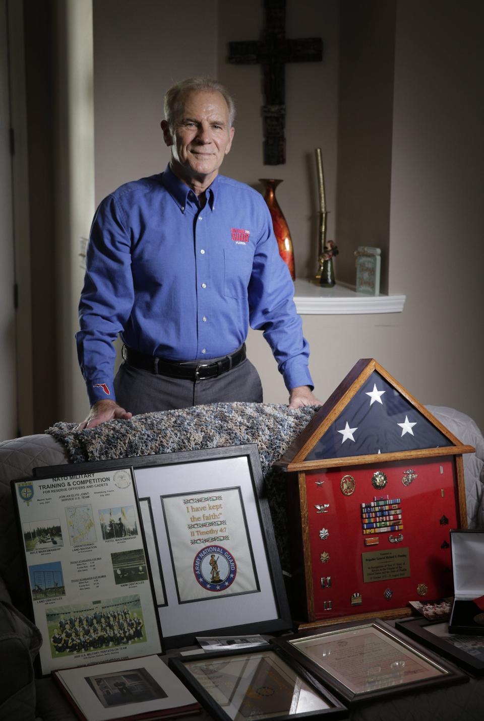 Michael Fleming displays his military awards and medals at his St. Augustine home. The retired brigadier general served in the Marine Corps and the Army and will soon be inducted into the Florida Veterans Hall of Fame because of his post-military work with veterans.