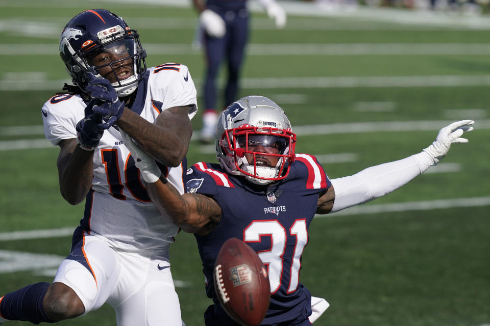 A pass to Denver Broncos wide receiver Jerry Jeudy (10) falls incomplete as New England Patriots defensive back Jonathan Jones (31) defends in the first half of an NFL football game, Sunday, Oct. 18, 2020, in Foxborough, Mass. (AP Photo/Steven Senne)