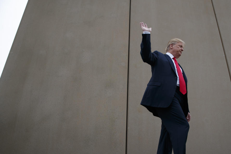 President Donald Trump talks with reporters as he gets a briefing on border wall prototypes, Tuesday, March 13, 2018, in San Diego. (AP Photo/Evan Vucci)