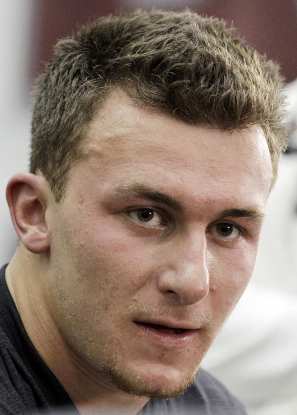 Texas A&M quarterback Johnny Manziel talks to members of the media during pro day for NFL football representatives in College Station, Texas, Thursday, March 27, 2014. (AP Photo/Patric Schneider)