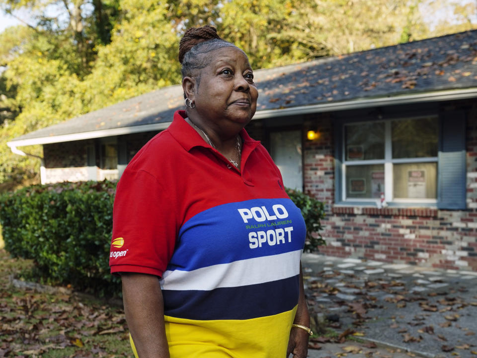 Georgia voter Cynthia Jones speaks in front of her home where she and her disabled sister live, Thursday, Nov. 3, 2022, in Atlanta. The Atlanta native sees a country split between haves and have nots. (AP Photo/John Bazemore)