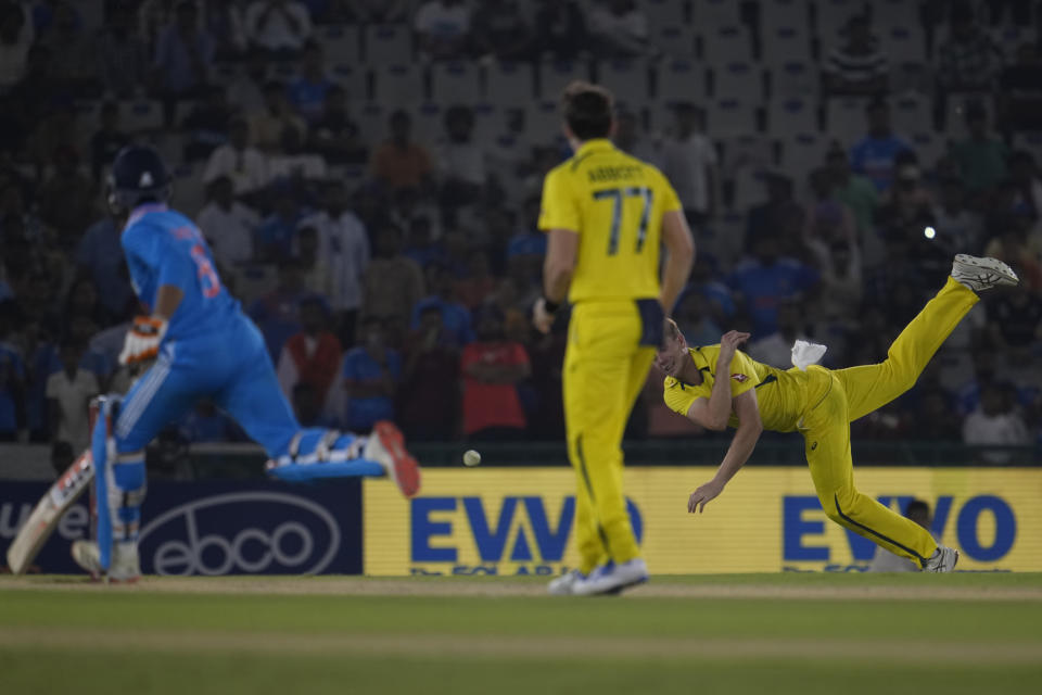 Australia's Cameron Green, right, unsuccessfully attempts to run out India's Ravindra Jadeja, left, during the first one day international match between Australia and India in Mohali, India, Friday, Sept. 22, 2023. (AP Photo/Altaf Qadri)