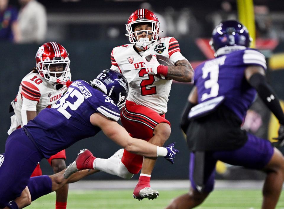 Utah Utes running back Micah Bernard (2) gets ready for the hit by Northwestern Wildcats linebacker Bryce Gallagher (32) as Utah and Northwestern play in the SRS Distribution Las Vegas Bowl at Allegiant Stadium on Saturday, Dec. 23, 2023. Northwestern won 14-7. | Scott G Winterton, Deseret News