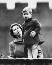 <p>King Charles III was just a nine-year-old boy when his mother made him the Prince of Wales. It is a title traditionally given to the heir apparent to the English and later British throne. </p><p>Pictured: Princess Elizabeth (later Queen Elizabeth II) and Prince Charles watching a procession from the wall of Clarence House, London, 22nd November 1950</p>